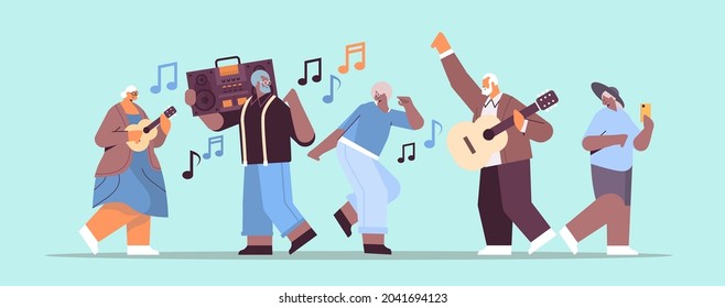 mix race senior people with bass clipping blaster recorder dancing and singing grandparents having fun active old age