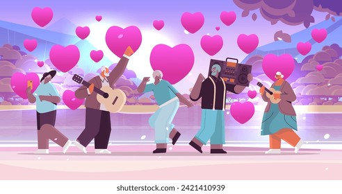 mix race senior people in love with bass clipping blaster recorder dancing and singing grandparents having fun active old age valentines day