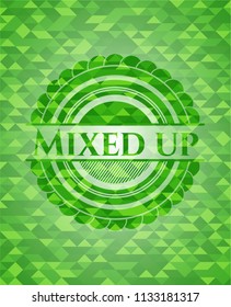 Mixed up green emblem with triangle mosaic background