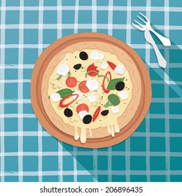 Mixed pizza on a scotch table cloth 