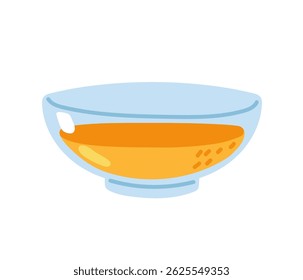 Mixing ingredients in a clear bowl for a bright orange liquid