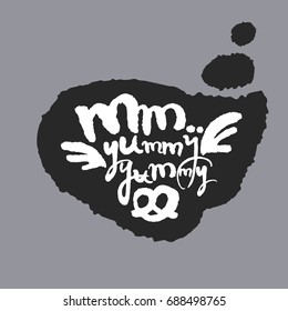 Mm Yummy Yummy. Hand written calligraphy phrase in a speech bubble. White on black. Clipping paths included.