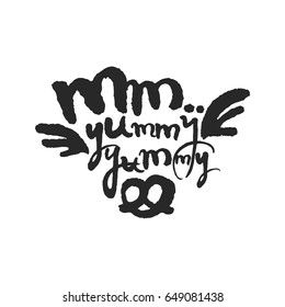 Mm Yummy Yummy. Hand written phrase in calligraphic style. Black on white background. Clipping paths included.