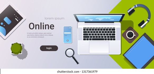 mobile computer app online top angle view workplace desktop with laptop tablet smartphone screen office stuff horizontal copy space
