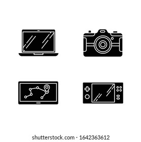 Mobile devices black glyph icons set on white space. Pocket electronic gadgets. Technology. Navigation assistant, game console. Laptop, photo camera. Silhouette symbols. Vector isolated illustration