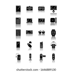 Mobile devices drop shadow black glyph icons set. Handheld small electronic gadgets. Smartphone, laptop, computer. E-readers. Cameras. Pocket digital tool. Isolated vector illustrations on white space