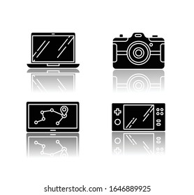 Mobile devices drop shadow black glyph icons set. Pocket electronic gadgets. Smart technology. Navigation assistant, game console. Laptop, photo camera. Isolated vector illustrations on white space