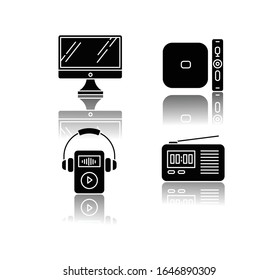 Mobile devices drop shadow black glyph icons set. Pocket electronic gadgets. Smart technology. Desktop computer, MP3 music player. Radio set, media player. Isolated vector illustrations on white space