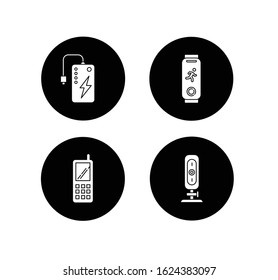 Mobile devices glyph icons set. Pocket electronic gadgets. Smart technology. Powerbank. Fitness tracker. Cell phone, web camera. Digital tools. Vector white silhouettes illustrations in black circles