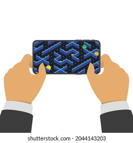 Concepto de juego móvil, diseño plano. Hombre sujetando el smartphone y jugando en un juego retro. Ilustración vectorial. EPS 10.