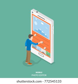Mobile image editor flat isometric vector concept. Man is editing a picture on the smartphone by applying some filters and changing some other settings.