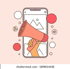 Mobile marketing and digital marketing concept. Hand holding megaphone coming out from smartphone. 