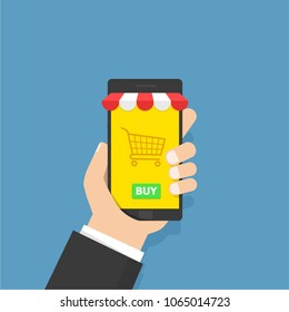 Mobile online shopping concept. Hand holding smartphone with shopping cart and button on the screen. Vector illustration isolated on white background