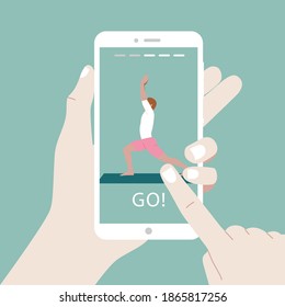 A mobile online yoga classes. The guy standing in the warrior pose Virabhadrasana. Home practice of yoga exercises. Stories Mobile Interface. Stay home, new reality. 