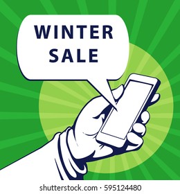 Mobile phone in businessman hand. Hand using smartphone, with a speech bubble, saying winter sale, vector illustration