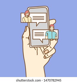 Mobile phone chat message notifications vector illustration isolated on color background, hand with smartphone and chatting bubble speeches, concept of online talking, speak, conversation, dialog.