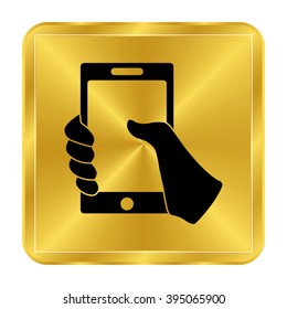 Mobile phone in hand - black vector icon;  gold button