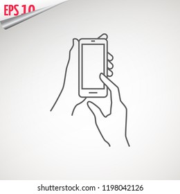 Mobile phone in hand. Holding a smartphone. Hand with phone web line icon. isolated on background.