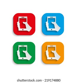 Mobile phone in hand icon with shadow