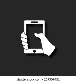 Mobile phone in hand  - vector icon with shadow
