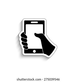 Mobile phone in hand - vector icon
