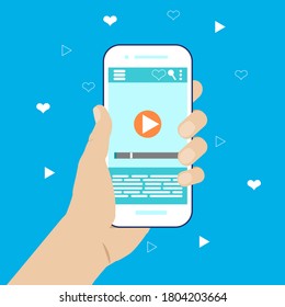 Mobile phone in hand with a video player on the screen. Video application for smartphones. Streaming video on your phone. Vector flat illustration for advertising, websites, banners, infographics.