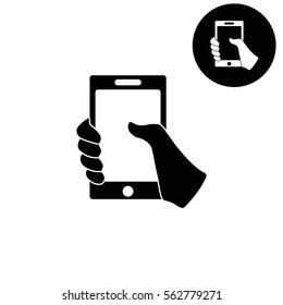 Mobile phone in hand  - white vector icon