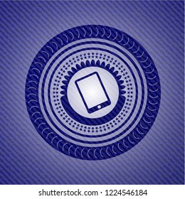 mobile phone icon inside badge with jean texture