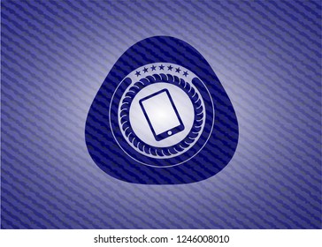 mobile phone icon inside badge with denim background