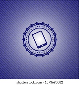 mobile phone icon inside badge with denim background