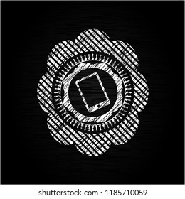 mobile phone icon inside chalkboard emblem written on a blackboard
