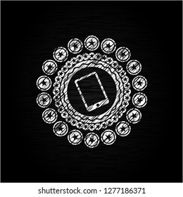 mobile phone icon inside chalkboard emblem written on a blackboard