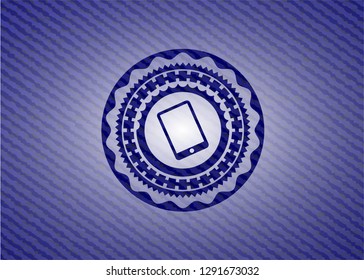 mobile phone icon inside emblem with jean texture
