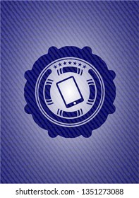 mobile phone icon inside emblem with denim high quality background