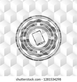 mobile phone icon inside grey emblem with geometric cube white background