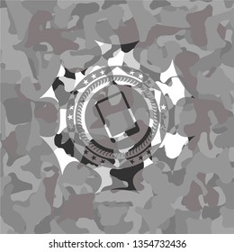 mobile phone icon inside grey camouflaged emblem