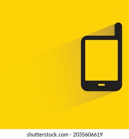 mobile phone with shadow on yellow background