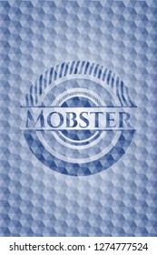 Mobster blue badge with geometric pattern background.