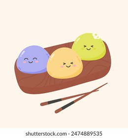 Mochi deserts with smiling face on a wooden board