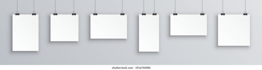 Mock up hanging empty white paper blank. Concept gallery portfolio, photo frame paper, poster. Creative of blank posters hanging list with shadows. Hanging white paper on binders, sheet on wall