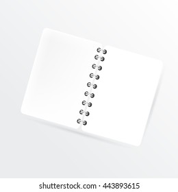 Mock up opened spiral notebook  with a clean space for your design concept. 
