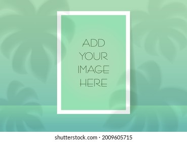 Mockup A4. Paper sheets. Shadows overlay leaf and window light effects on a green background