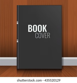Mockup of black book cover. Realistic Textbook, booklet, notepad or notebook for your design and branding with wood wall background.
