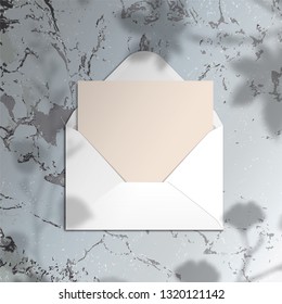 Mock-up with blank paper background card with ginkgo leaves branch shadow on marble surface. Mock up scene creator Styled banner social media. branding design. Space for text Feminine greeting desktop
