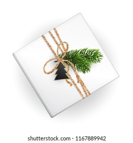 A mockup of a Christmas gift box for your pattern. Top view. Realistic illustration. Clen and white for wrapping paper template. Decoration of Christmas toy, line rope and Christmas branches. EPS10.