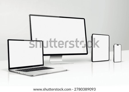 A mockup of computer screen, laptop, tablet, smartphone on a table