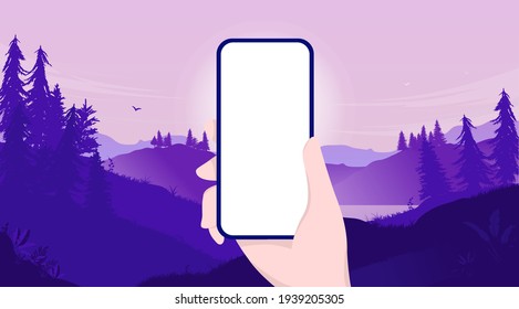 Mockup of hand holding phone with blank screen and landscape background. Template for you own app design. Vector illustration.