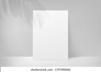 Mockup poster with shadow plant leaf from the window. Mock up sheet paper. White empty blank. Vector illustration
