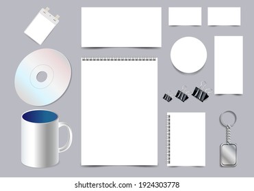 mockup a set of commercial items for branding, notebooks, business cards, information posters, cd disc, mug and badge