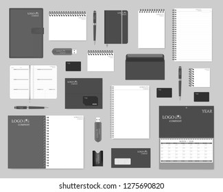 Mock-up set for corporate brand identity design. Notebooks, envelopes, business cards, card holders, pens, USB flash drives, calendars. Vector template.